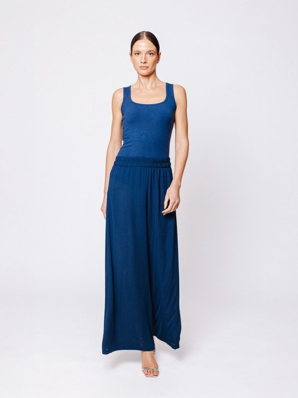 Pantalone in tripla georgette a palazzo con sfondo piega laterale