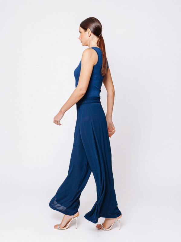 Pantalone in tripla georgette a palazzo con sfondo piega laterale