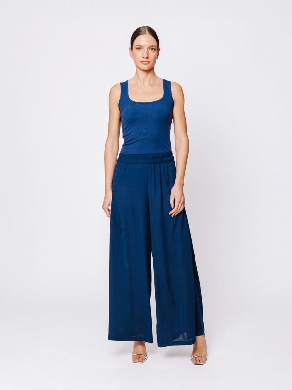 Pantalone in tripla georgette a palazzo con sfondo piega laterale