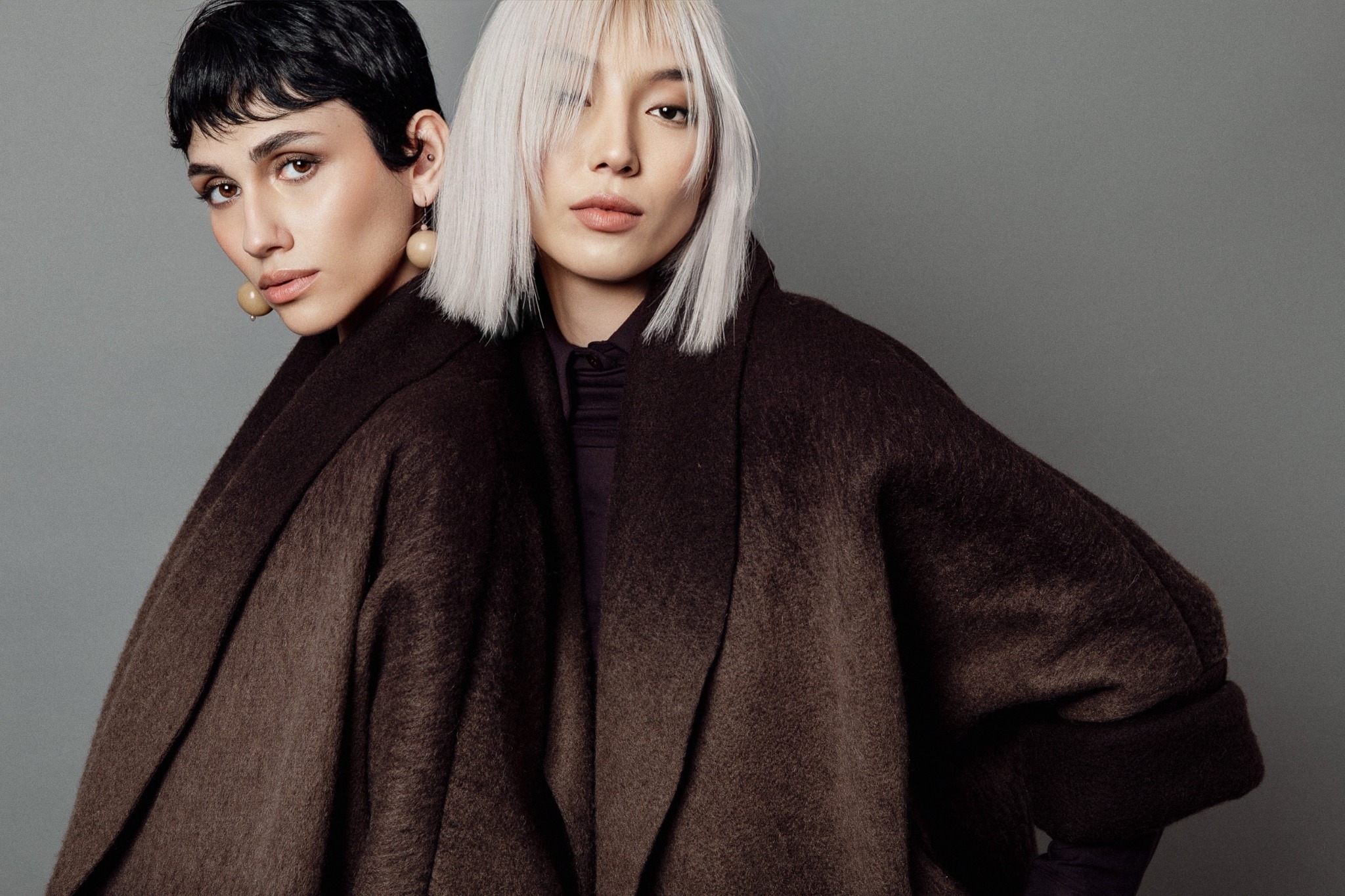 Portrait of two models in brown coats